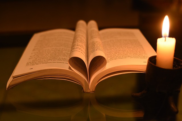Open book with candle