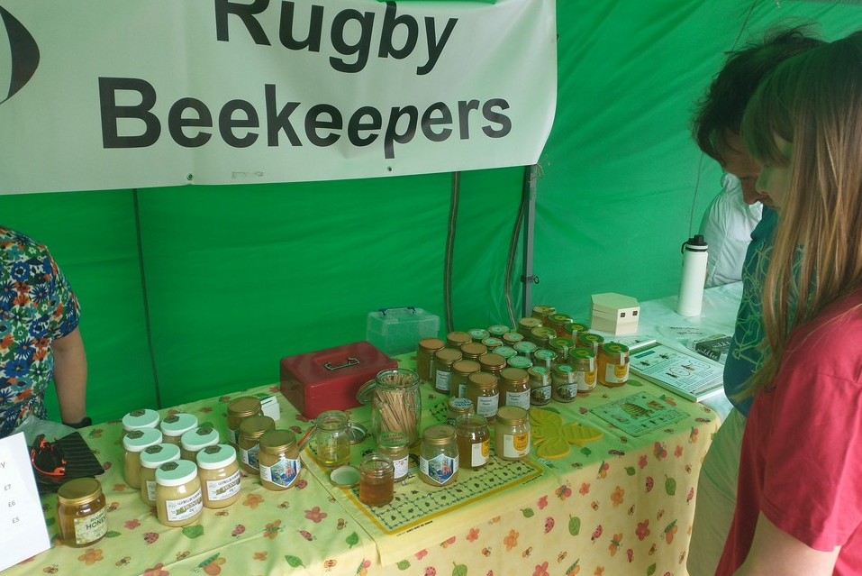 table with jars of honey on for sale