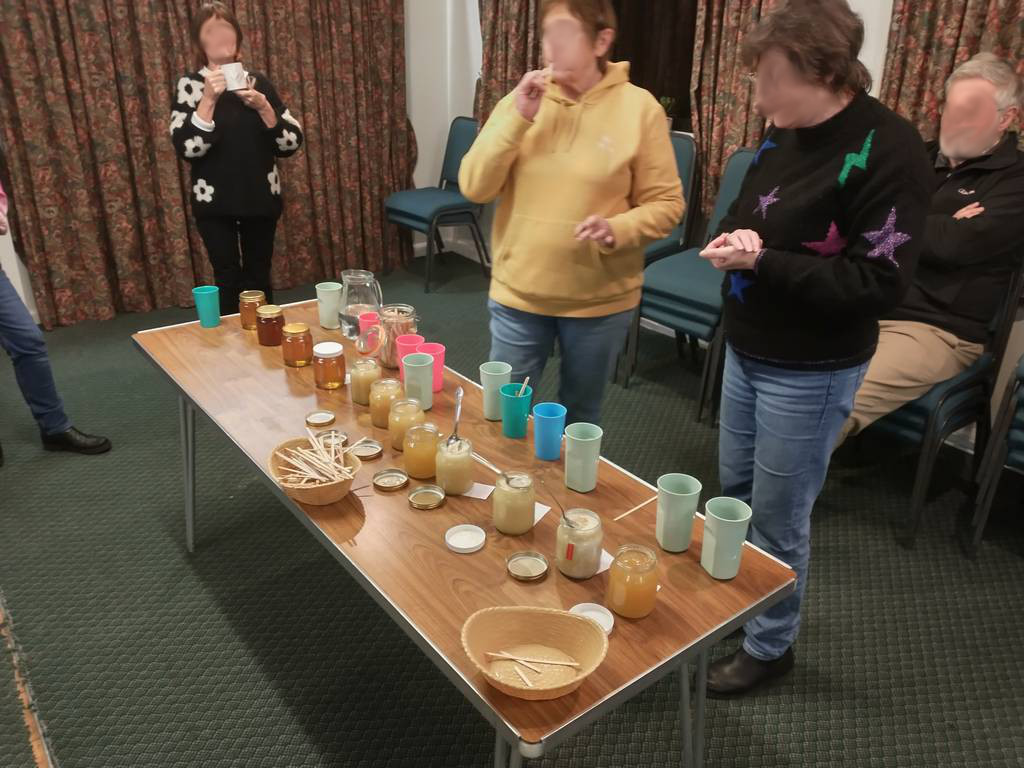 people tasting honey